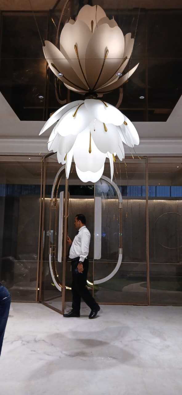 Massive floral designer chandelier installed in the grand entrance lobby of a luxury property in Mumbai.